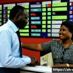 중앙아프리카 공화국 환전 및 통화 정보 - **Prompt 1: Currency Exchange at a Local Bank in Central African Republic**
    A brightly lit, mode...